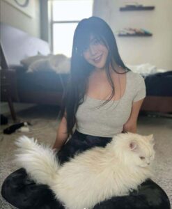 Quqco with her cat