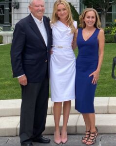 Rikki Schlott with her parents